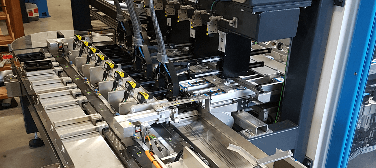 HepcoMotion - Low maintenance packaging solution for printer cartridges allowing on the fly product changes